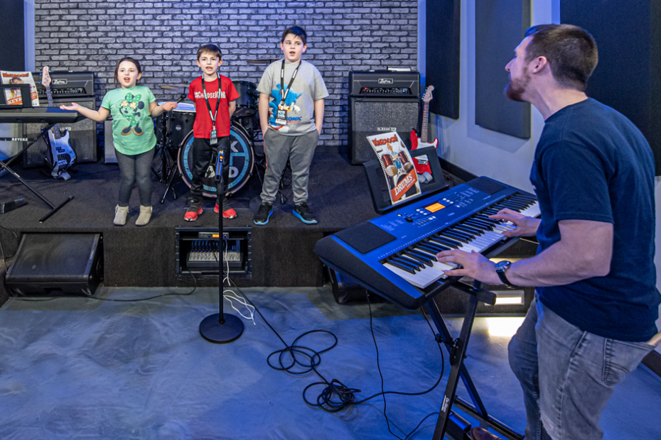 Kids learning to play live music.